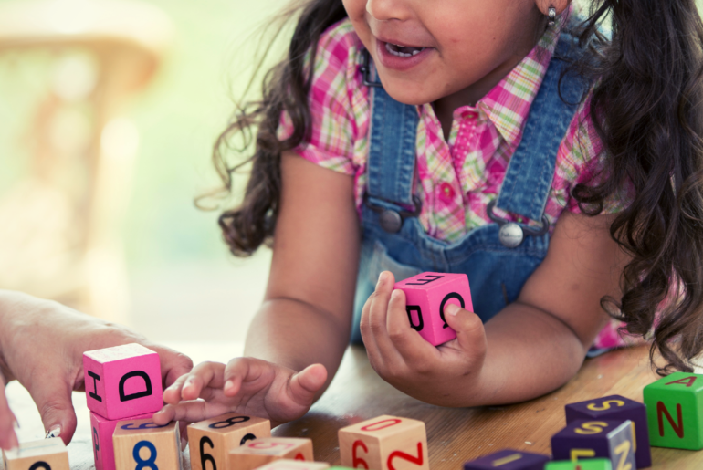 Girl playing with blocks.