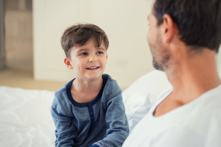 Dad talking to son.