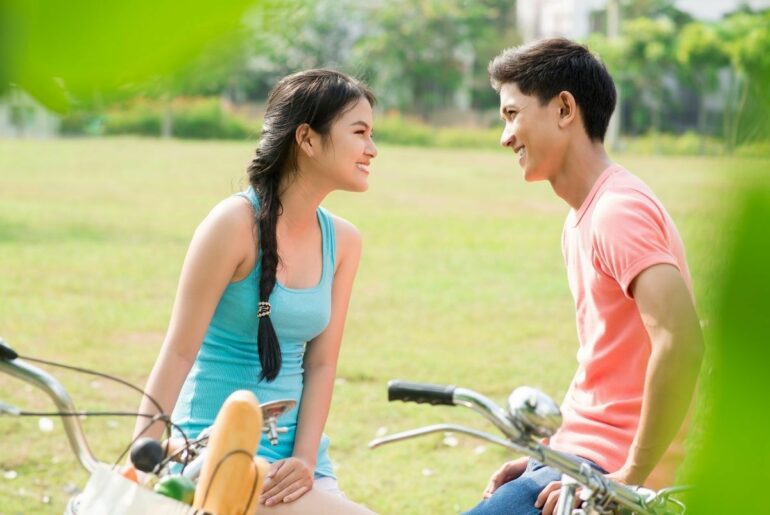 Teens smiling at each other.