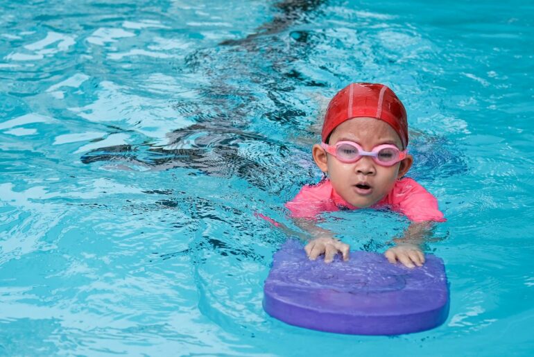 Child swimming in pool