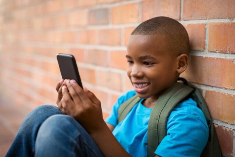 Young boy using smartphone